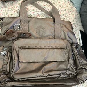 Kipling multi use backpack crossbody comes w/matching double pouch.